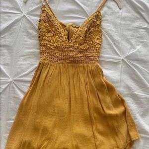 Yellow Romper with tied bow in the back!